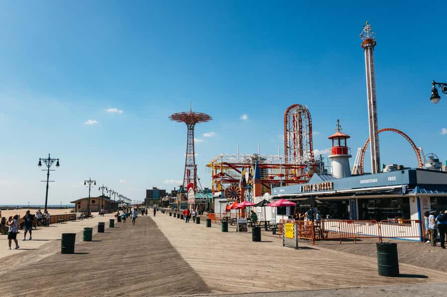From Manhattan: Full-Day NYC Boroughs and Coney Island Tour - Queens and Flushing Meadows Park: parks, languages, and the Unisphere