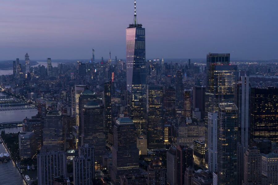 From New Jersey: New York City Skyline Tour - Night flight magic: close to the Statue of Liberty, then Hudson River headlight glow