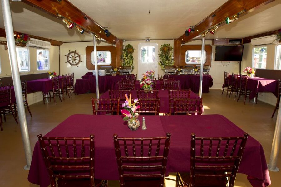 Key West: Sunset Dinner Cruise with Open Bar & Live Music - Dinner below deck: tropical buffet comfort food