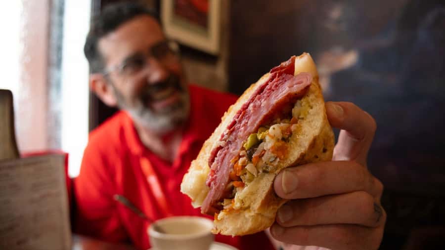 New Orleans: Beloved Bites & Famous Dishes Food Tour - Poboy or muffuletta, two sandwiches, two directions