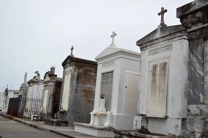New Orleans Cemetery Bus Tour with Exclusive Cemetery Access - Charity Hospital Cemetery Area: Gate Looks and Limited Night Access