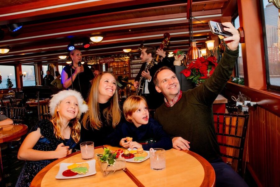 NYC: Holiday Yacht Cruise with Jazz, Cocoa & Carols - Live Jazz Trio, Singing, and Caroling in a Comfortable Room
