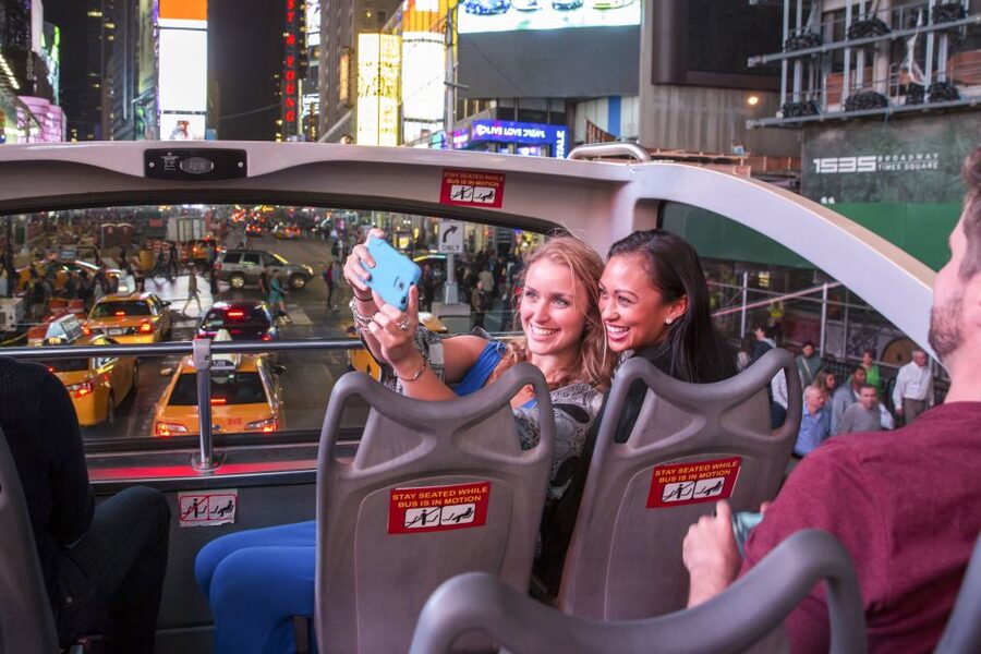 NYC: Sightseeing Night Tour by Open-Top Bus with Live Guide - Times Square and Broadway theater blocks after dark