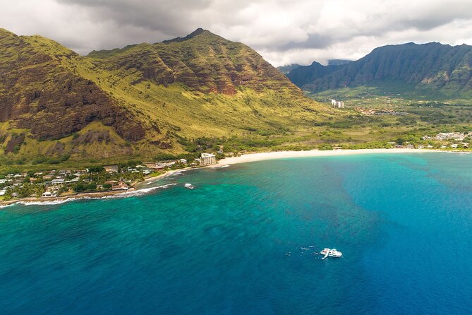 Oahu Dolphin and Snorkel Tour with Waikiki Pickup & Lunch - The onboard “water playground”: slide, kayaks, and stand up paddle boards