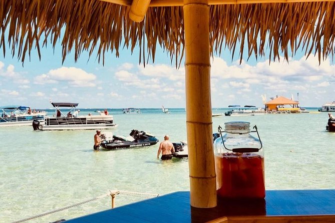 Original Cruisin' Tikis 3hr Crab Island Sandbar Adventure - Onboard setup: cooler, ice, cups, and BYOB math
