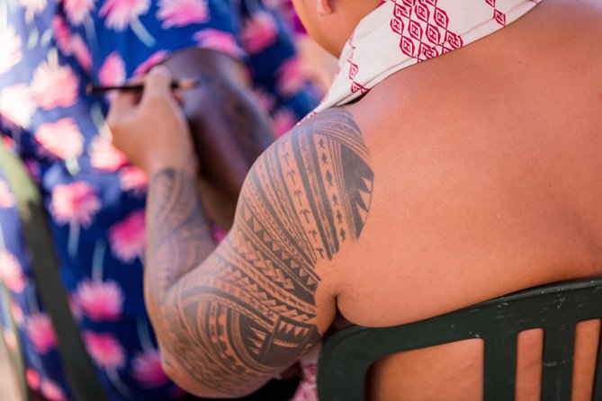 Paradise Cove Luau - Main Show Vibe: Musicians, Hula, and Fire Twirlers at Sunset