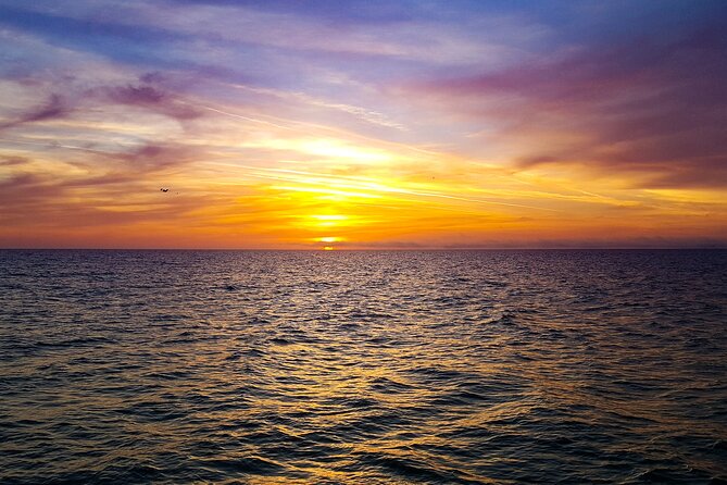 Sunset Celebration Cruise on Tropics Boat Tours - Board the Tropics Boat Tours catamaran, then settle in